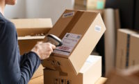 Person scanning a label on a box